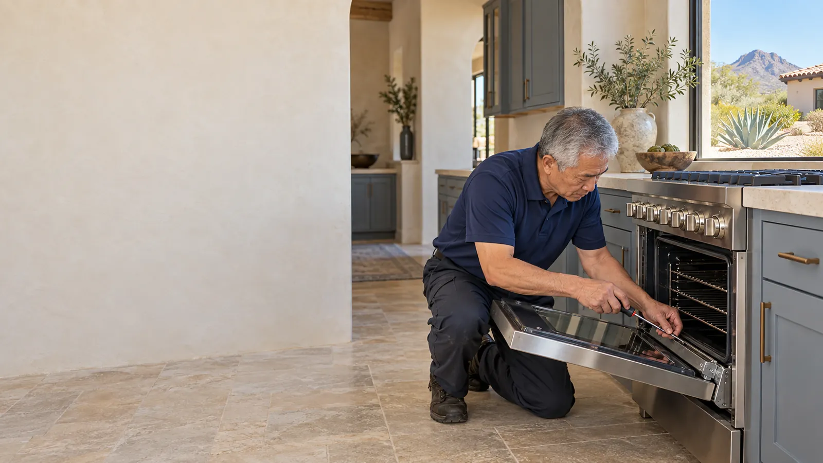 Viking appliance repair: technician adjusting the oven door hinge of a pro-style range